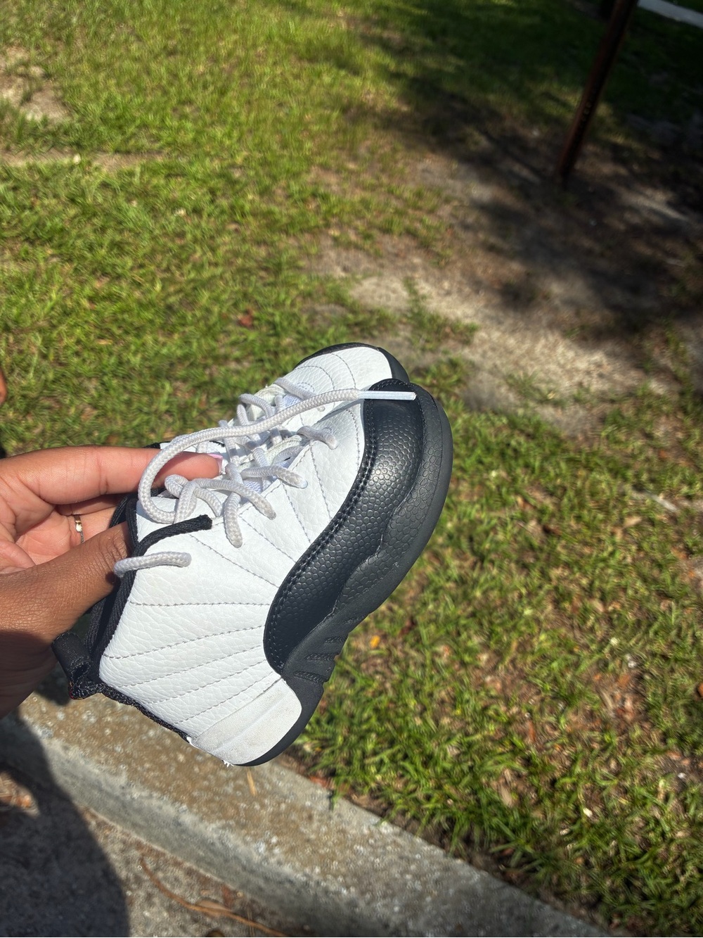 Kids Jordan White and Black Retro 12 Sneakers